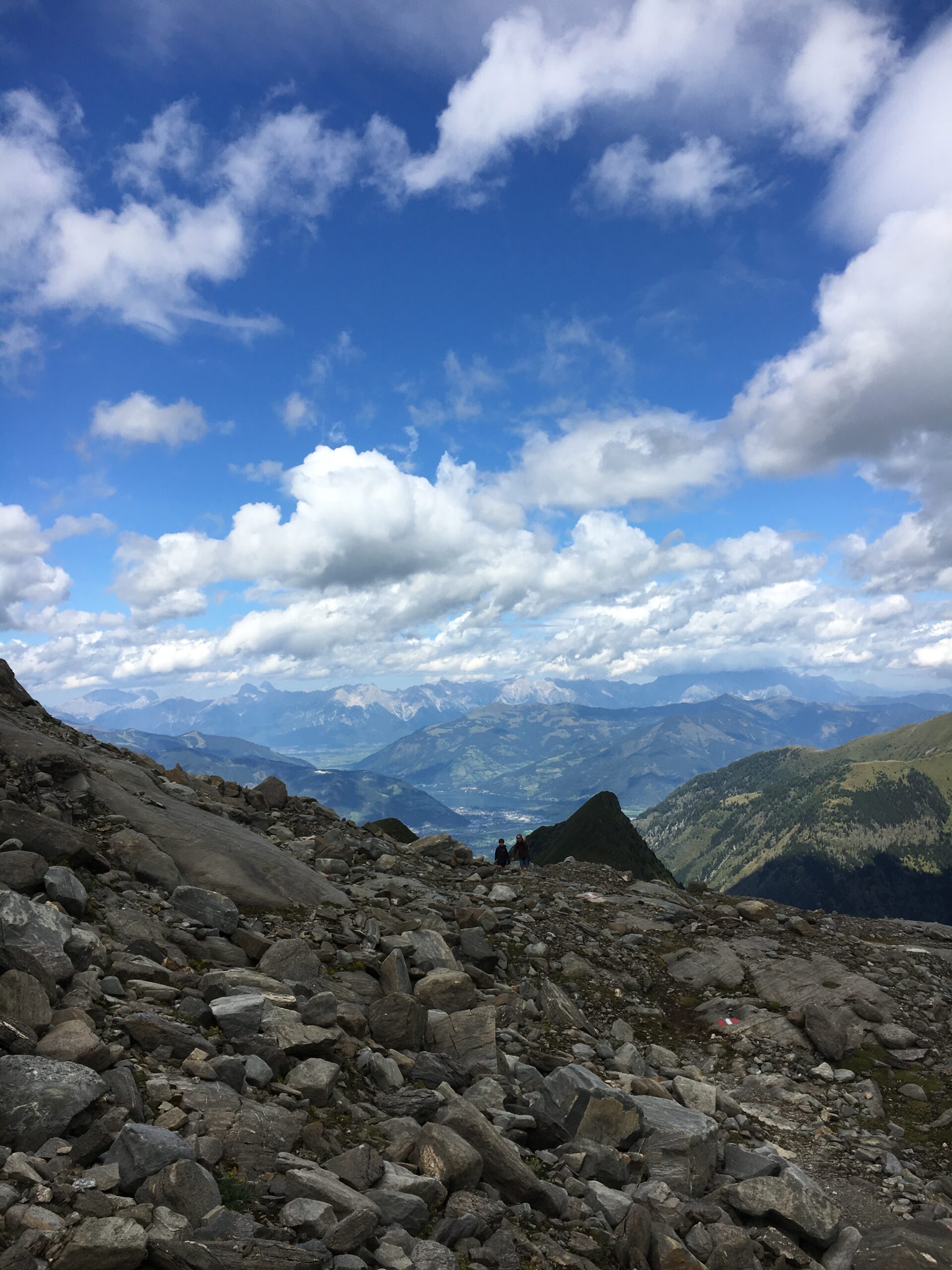 A rocky high overlook above layered ridges
